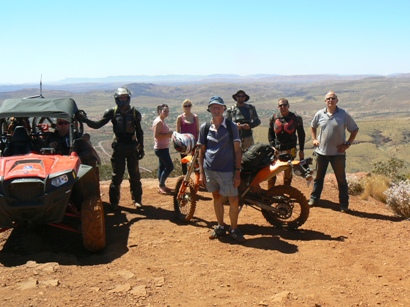 John meets new friends at the top of Mount Nameless