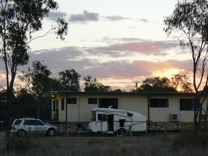 Caravan in front of 'The Lodge' at sunset