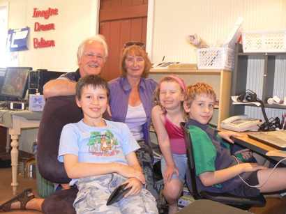 John and Judy with Thomas, Sophia and Connor in the school room